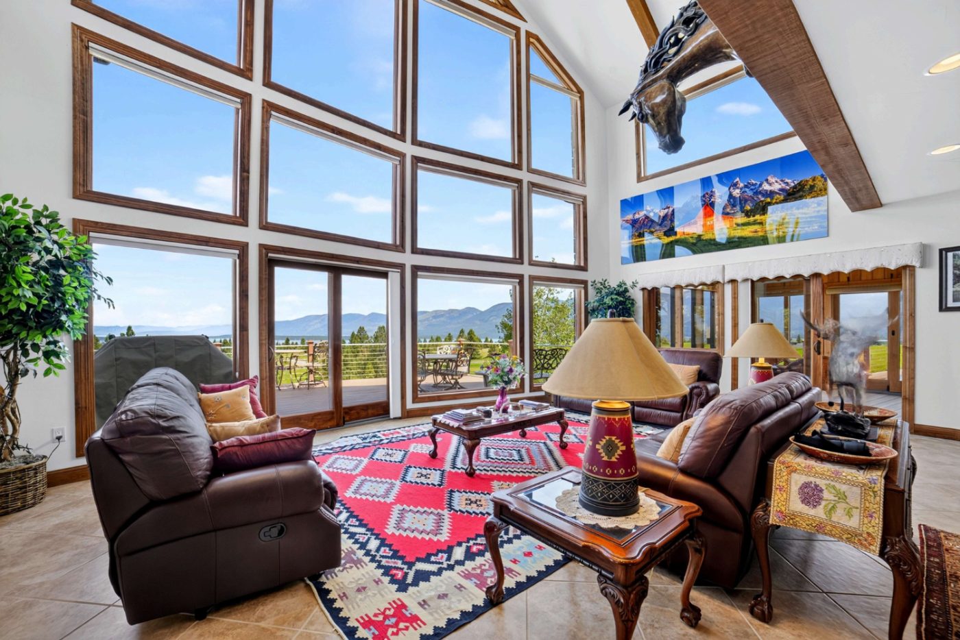 Great room with floor-to-ceiling windows overlooking Flathead Lake